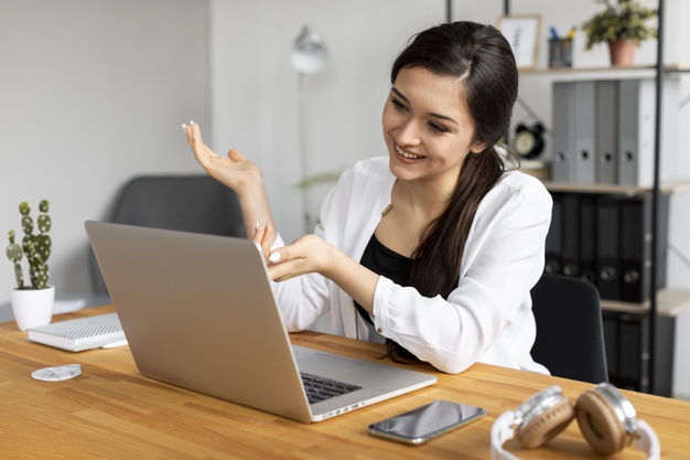medium-shot-smiley-woman-working_23-2148924723